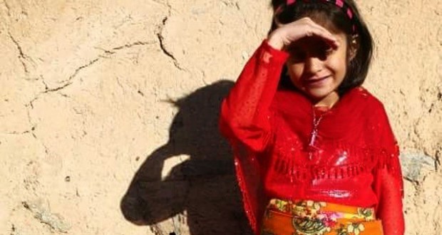 نگاره:  Her name is “Happiness”, in Kurdish “Shokhan”. She has spent half of her life of seven years in buses and hospitals to do treatment and surgeries on her eyes which got blind after a medical mistake: a penicillin test was missed by a doctor and now another doctor is doing surgery on her eyes to try to lighten up her world again. “Come over here to have a more beautiful shadow on the wall, Shokhan” I say. She turns to me and asks: “Shadow?” Her question makes me pause. She moves a little. I explain: "Look! Sun is so shining from my side here.” While I was thinking to myself why I started my sentence with “look”, she lifts her hand to shield her bandaged eyes from the sun and says: “Is that OK?” “Great!” I say and click.